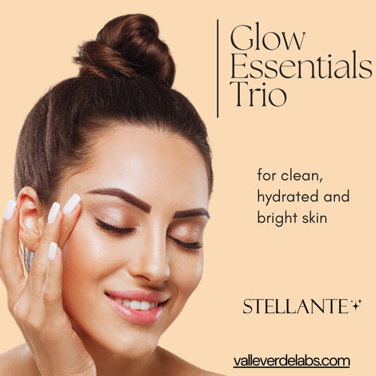 Advertisement for Stellante Glow Essentials Trio with a woman touching her face on a beige background.